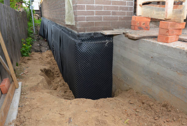 Happy homeowners after waterproofing job in Carleton